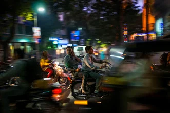 Urban scene with mopeds in Pune during rush hour