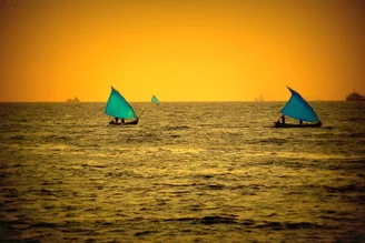 Photo art by Jml Laufs: Fishing boats at sunset over the Indian Ocean