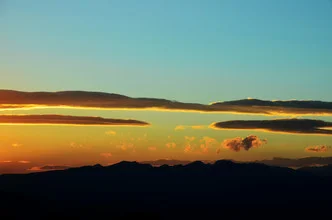 Photo art by Michael Brandone: sunset over the valley with soft clouds.