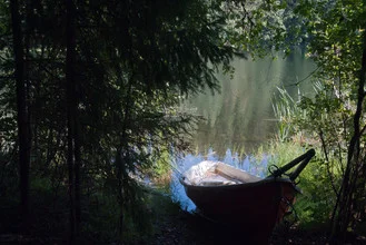 Photo art by Pekka Liukkonen: A boat ashore on a calm Finnish lake