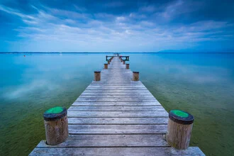 Photo art: serene jetty at Chiemsee with gentle waves and mountains in the background