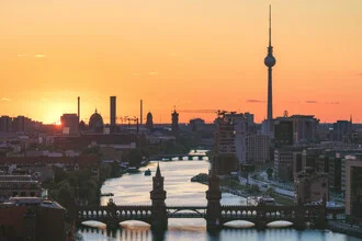 Photo art by Jean Claude Castor: Berlin skyline at sunset over the Spree river.