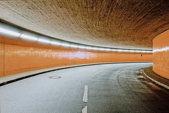 Photo art by Michael Belhadi: underground garage with orange lighting in Berlin