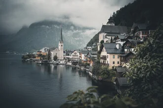 Photo art by Franz Sussbauer: atmospheric village by Hallstatt lake on a cloudy day