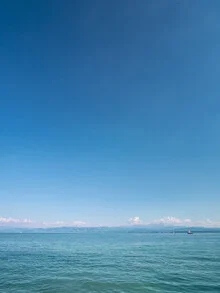 Photo art: serene Lake Constance shot with gentle waves and soft light