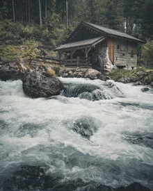 Photo art by Franz Sussbauer: historical mill by a calm creek in the Alps.