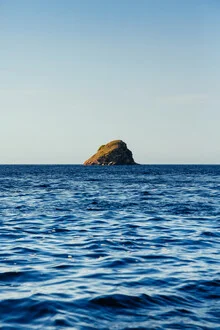 Photo art by Lars Brauer: calm view of a small rock in Indonesian waters