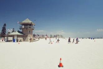 Photo of a lifeguard at Coronado Beach, conveying a relaxed summer vibe.