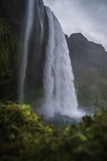 Photo art by Max Saeling: tranquil waterfall in Iceland, long exposure with splashing water