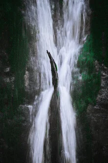 Photo art: serene waterfall image with mossy stones