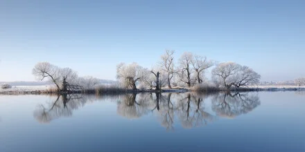 Winter landscape in Havelland with calm river and reflecting trees