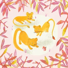 Wall art featuring two lion cubs playfully interacting with each other.