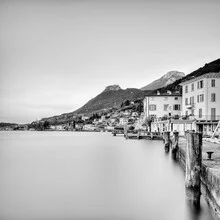 Sunrise over Gargnano at Lake Garda with calm water and soft mountains