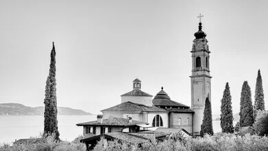 Photo art by Dennis Wehrmann: Church by Lake Garda with cypress trees in the foreground.