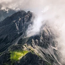 Photo art by Thomas Kleinert: mountain peak surrounded by clouds in soft colors