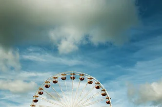 Photo art by Manuela Deigert: Ferris wheel in the sky, symbolizing freedom and fun.