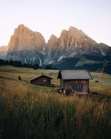 Photo art by André Alexander: serene mountain landscape with gentle hills and a cabin