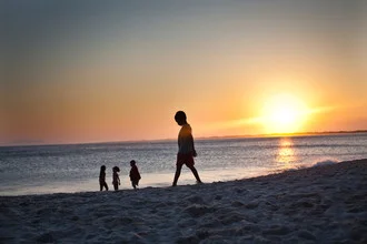 Photo art by Davi Boarato: children playing on Rio de Janeiro beach at sunset.