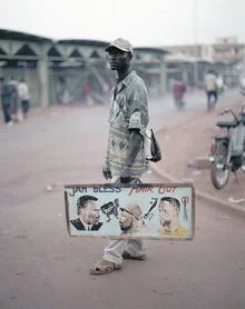 Photo art by René Ruis: A street vendor giving a haircut in Ouagadougou, Burkina Faso.