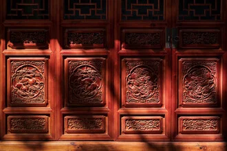 Light play at a temple in China highlighting the fine carvings.