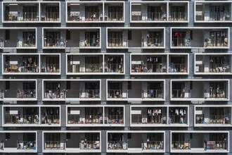Image of laundry hanging in an urban setting, showcasing symmetry and everyday life.