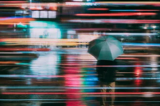 Photo art of a pedestrian with an umbrella in Taipei at night