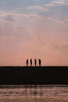 Photo art by AJ Schokora: calm sunset with reflective silhouettes