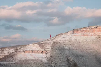 Photo art by AJ Schokora: clouds over Cappadocia mountains under a calm sky.
