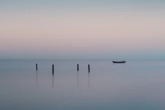 Calm water surface of Lake Tai at dusk, soft colors and a peaceful mood.