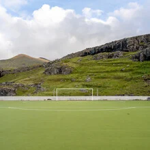 Photo of artificial grass, a swing, and mountains, a serene nature scene