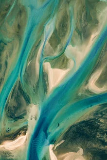 Pastel patterns on the water showcasing gentle waves and curves.
