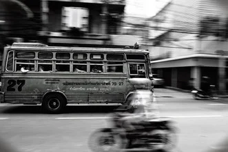 Photo art by Thomas Halfmann: motorcycle rider on a busy road in Bangkok during the afternoon.