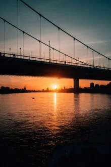 Photo art by Joshua A. Hoffmann: sunset over the river in Cologne