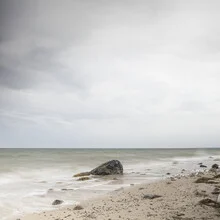 Photo art by Michael Schulz-dostal: calm view of the sea with stones in the foreground.