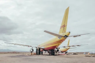 Photo art by Inflight Galerie: airplane in the desert against a blue sky