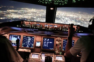 Photo art: cockpit lights emit a calm, warm glow in the cockpit setting.