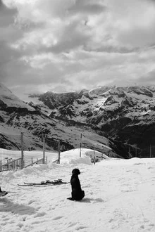Photo art by Tanapat Funmongkol: dog waiting in snow under cloudy sky.