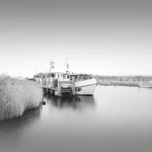 Photo art by Dennis Wehrmann: serene fishing boat at calm water
