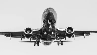 Photo art by Inflight Galerie: airplane shot against a clear sky