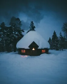 Photo art by Patrick Monatsberger: cozy cabin in snow during blue hour.