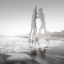 Photo art by Ronny Behnert: Molecule Men on ice in Berlin, winter cityscape.