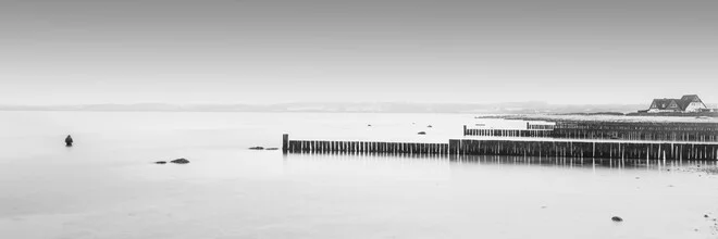 Panoramic view of the Baltic Sea at Hohwacht, calm atmosphere with gentle waves.