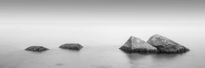 Photo by Dennis Wehrmann: tranquil Baltic Sea landscape with stones and gentle waves