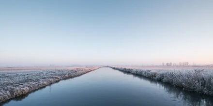 Winter landscape featuring a frozen river and meadows, soft shades of blue.