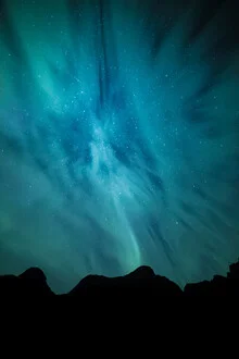 Beautiful sky with northern lights over a serene landscape in Norway