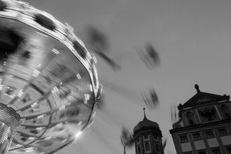 Photo art by Robert Hagstotz: colorful carousel on a road in Augsburg