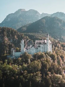 Photo art: aerial view of Neuschwanstein Castle surrounded by mountains in Bavaria