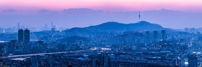 Photo art by Jan Becke: Night capture of Seoul's skyline with glowing towers.