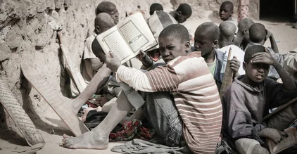 Photo art by Mathias Becker: Quran students in Timbuktu, friendly and contemplative mood.