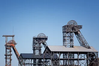 Photo art by Oliver Buchmann: Radbod colliery with headframe in an industrial area